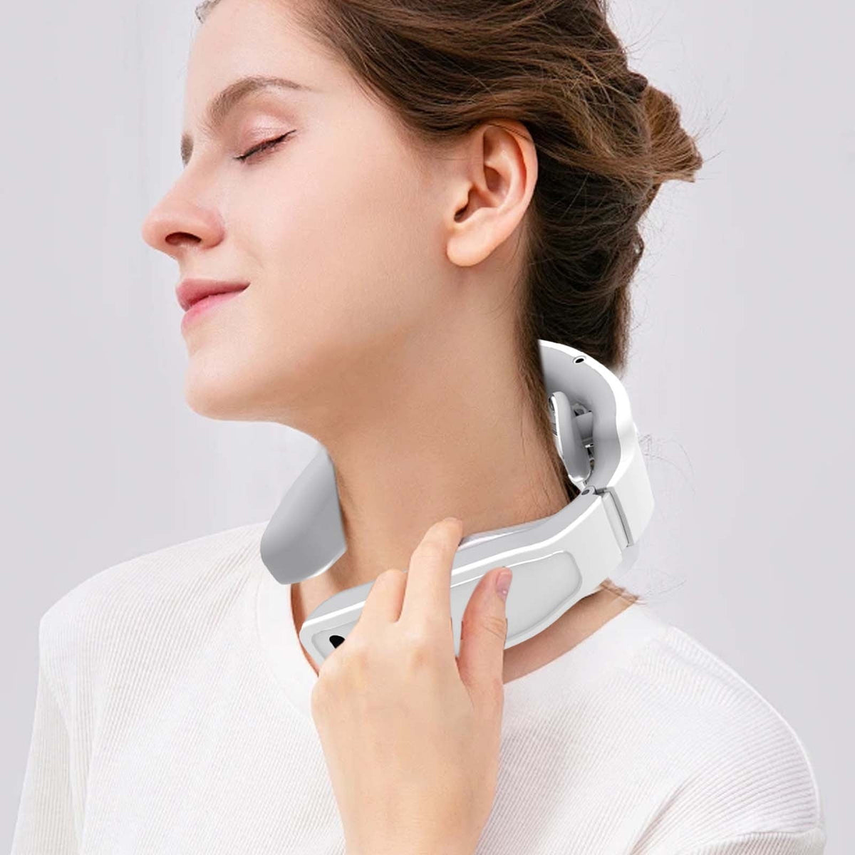 Portable neck massager in use